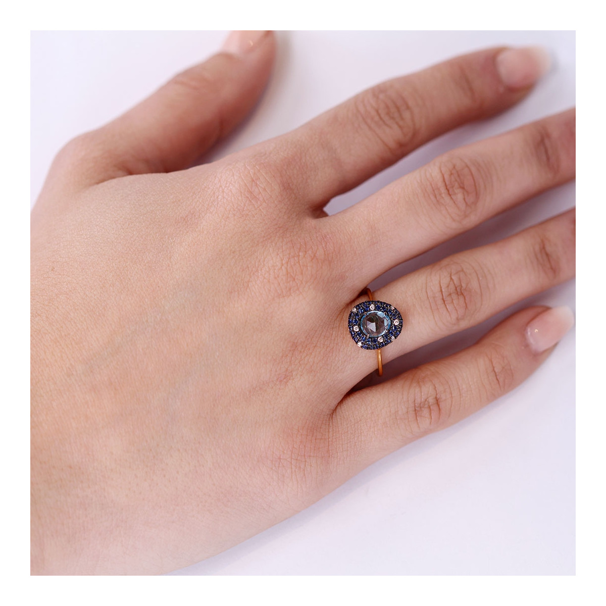 RING WITH BRIGHT BLUE TOPAZ AND SAPPHIRE